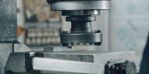 Close,Up,Of,A,Potente,Industrial,Stamping,Machine,Pressing,A Close,Up,Of,A,Potente,Industrial,Stamping,Machine,Pressing,A